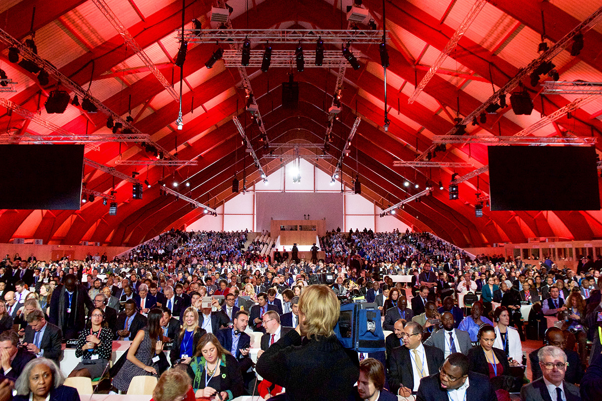 Delegates at the COP21 climate conference in Paris 2015 gather in the plenary hall.
